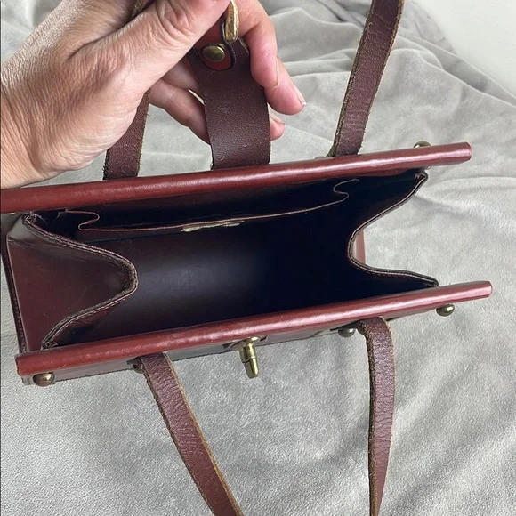 Vintage Brown Satchel with Structured Design and Metal Accents - Picture 12 of 15